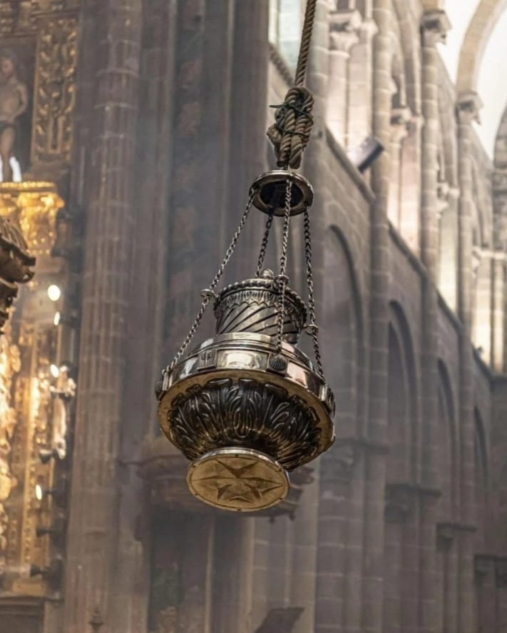 Botafumeiro incense burner swinging inside Santiago de Compostela Cathedral, one of the Symbols of El Camino